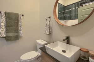 Bathroom with vanity and toilet