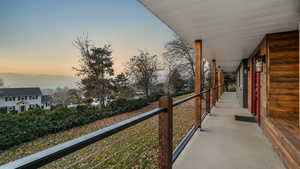 Balcony at dusk with a porch