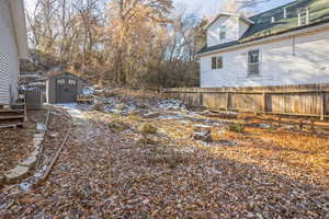 View of yard featuring a storage shed