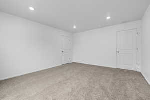 Unfurnished room with carpet