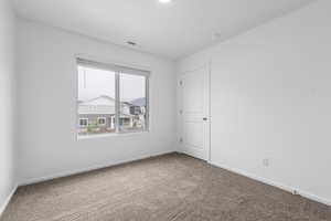 Unfurnished room with carpet flooring