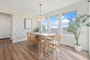 Dining area with wood-type flooring