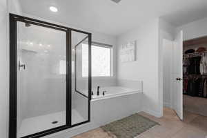 Bathroom featuring independent shower and bath