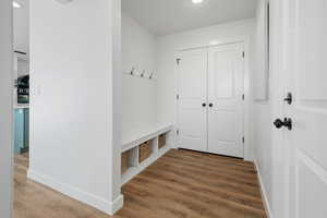 Mudroom with dark hardwood / wood-style floors