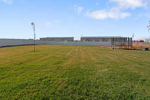 View of yard featuring a trampoline