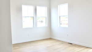 Empty room with light wood-type flooring