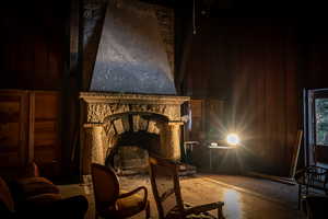 Living area featuring a stone fireplace