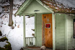 View of snow covered property entrance