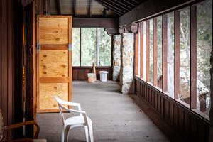 Unfurnished sunroom featuring plenty of natural light