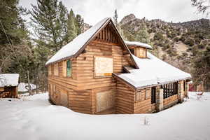 View of snowy exterior featuring a mountain view