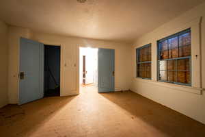 Spare room with a textured ceiling