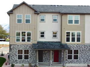 Back of property featuring a mountain view