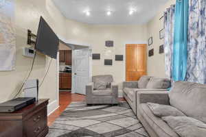 Living room featuring dark hardwood / wood-style flooring