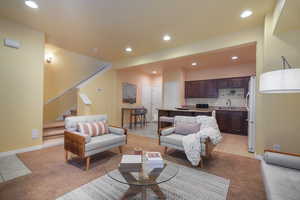 Living room featuring sink and light tile patterned flooring