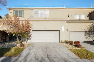 View of front facade featuring a garage