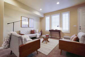 Living room featuring carpet flooring