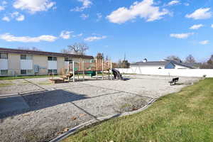 Exterior space featuring a playground and a yard