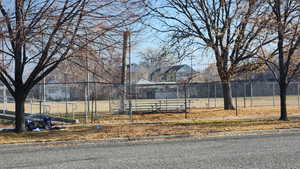 View of vacant lot to the S & W of subject to be developed by Ivory