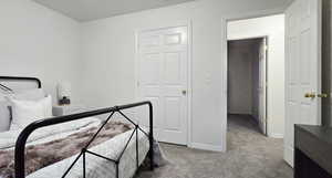 Bedroom with light colored carpet