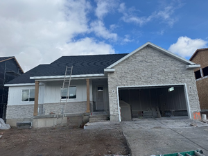 View of front of property with a garage