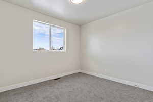 Empty room with carpet floors