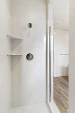 Bathroom featuring a shower and hardwood / wood-style flooring