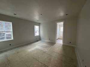 Spare room featuring a textured ceiling