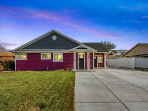 Ranch-style home featuring a yard