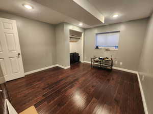 Bedroom 4 featuring a closet and dark hardwood / wood-style flooring