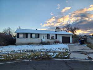 Single story home with a garage