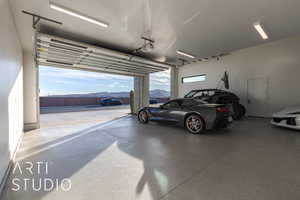 Garage with a mountain view and a garage door opener