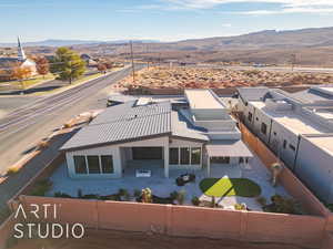 Birds eye view of property with a mountain view