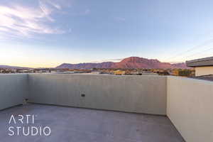 Balcony at dusk with a mountain view