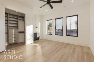 Unfurnished bedroom featuring ceiling fan, a closet, and light hardwood / wood-style flooring