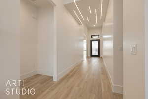 Hall featuring light wood-type flooring