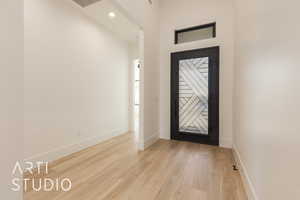 Foyer entrance featuring light wood-type flooring