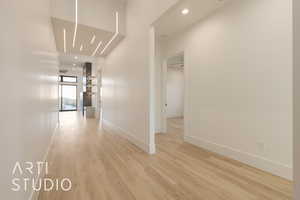 Hallway with light wood-type flooring