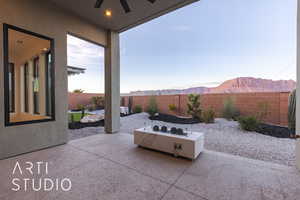 View of patio / terrace featuring a mountain view and ceiling fan