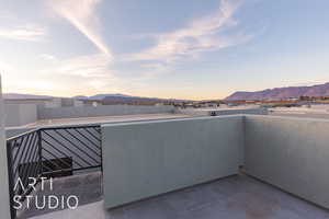 Balcony at dusk with a mountain view