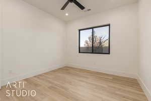 Empty room featuring ceiling fan and light hardwood / wood-style flooring