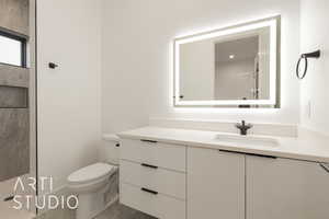 Bathroom with vanity and toilet