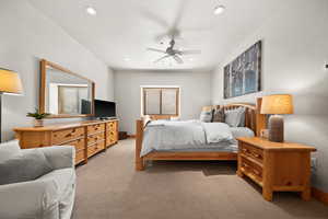 Carpeted bedroom with ceiling fan