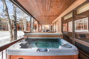 Exterior space featuring a hot tub