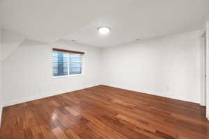 Bonus room featuring wood-type flooring