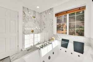 Bathroom with a tub to relax in