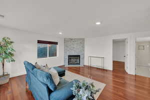 Living room featuring a fireplace and hardwood / wood-style flooring