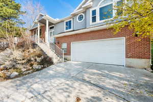 View of front facade featuring a garage