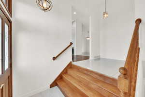 Foyer entrance with an inviting chandelier