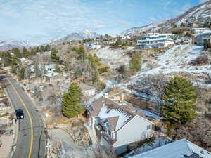 Snowy aerial view featuring a mountain view