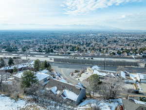 Snowy aerial view featuring a mountain view